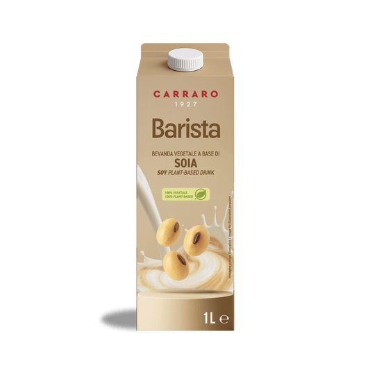 A 1-liter carton of Carraro 1927 Barista Soy plant-based milk, featuring soybeans splashing into creamy milk.