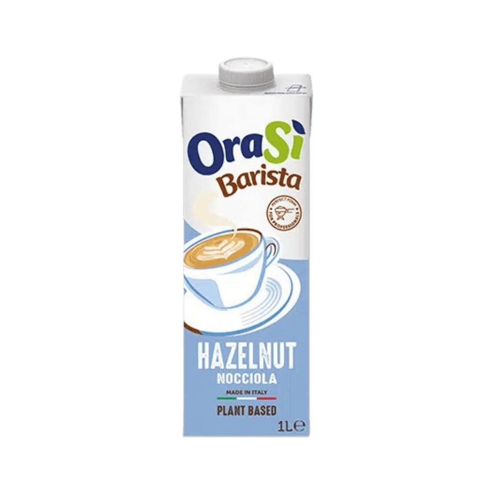 A 1-liter carton of OraSi Barista Hazelnut plant-based milk, featuring a light blue design with a frothy coffee.