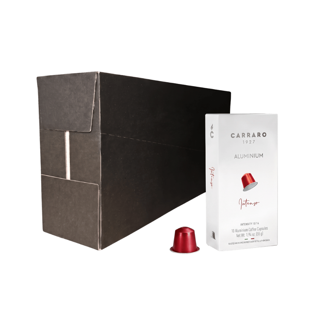Carraro 1923 Intenso coffee capsule packaging, featuring a large matte black outer box, a white inner box with a red capsule illustration, and a single red aluminium capsule in the foreground on a white background.