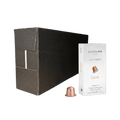 Carraro 1923 aluminium ristretto coffee capsules shown with a large black cardboard box, a white capsule box labeled 'ristretto', and one copper-colored capsule on a plain white background.